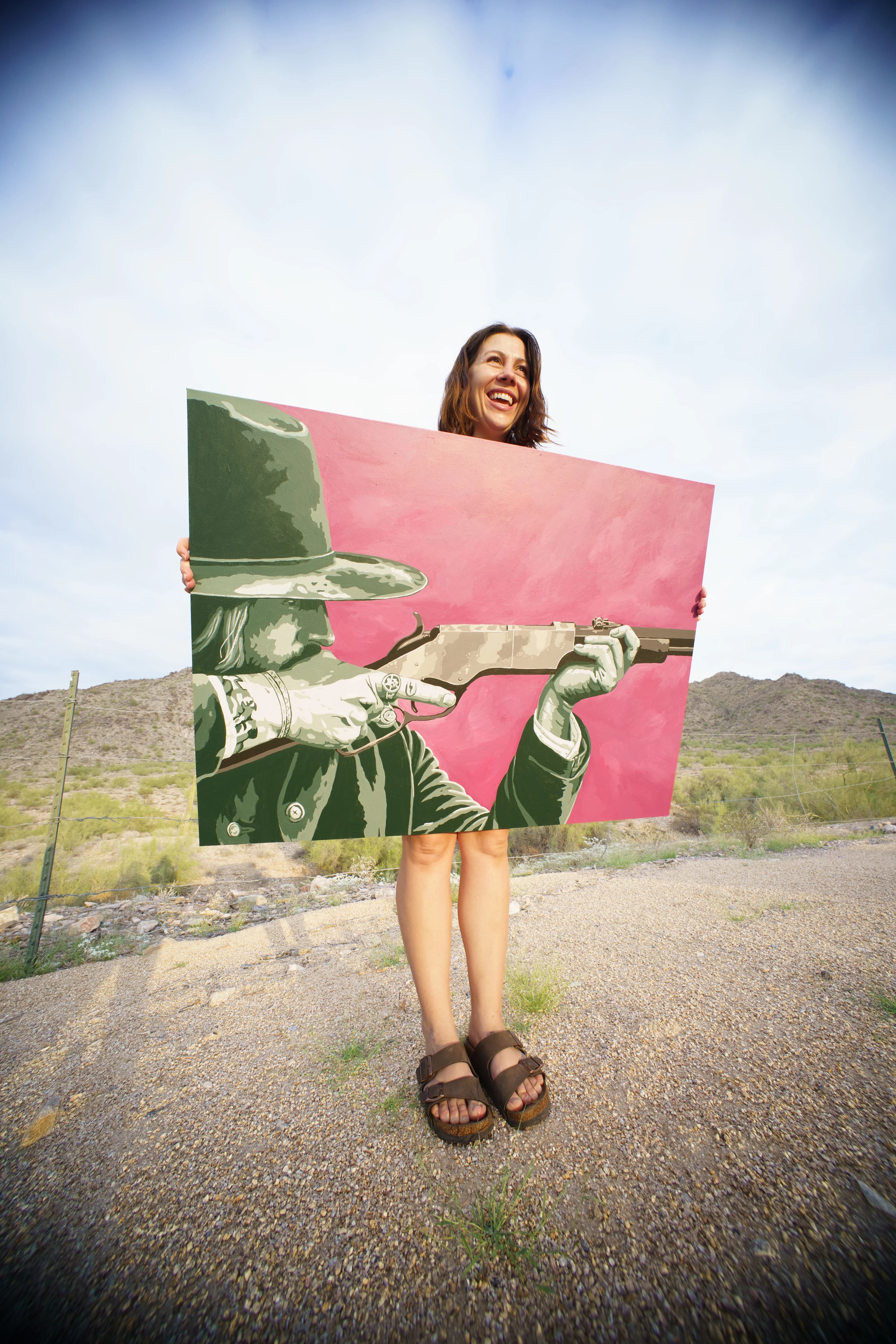 Holding the Barrels Up painting in the desert